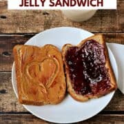 Looking down on a white plate with one slice of bread covered in peanut butter with a smear of jelly and a heart shape, and one slice of bread spread with jelly, with a glass of milk in the background and title graphic across the top.