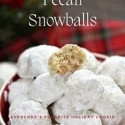 Pecan Snowballs stacked on top of each other in a holiday serving bowl surrounded by tartan plaid with title graphic across the top.