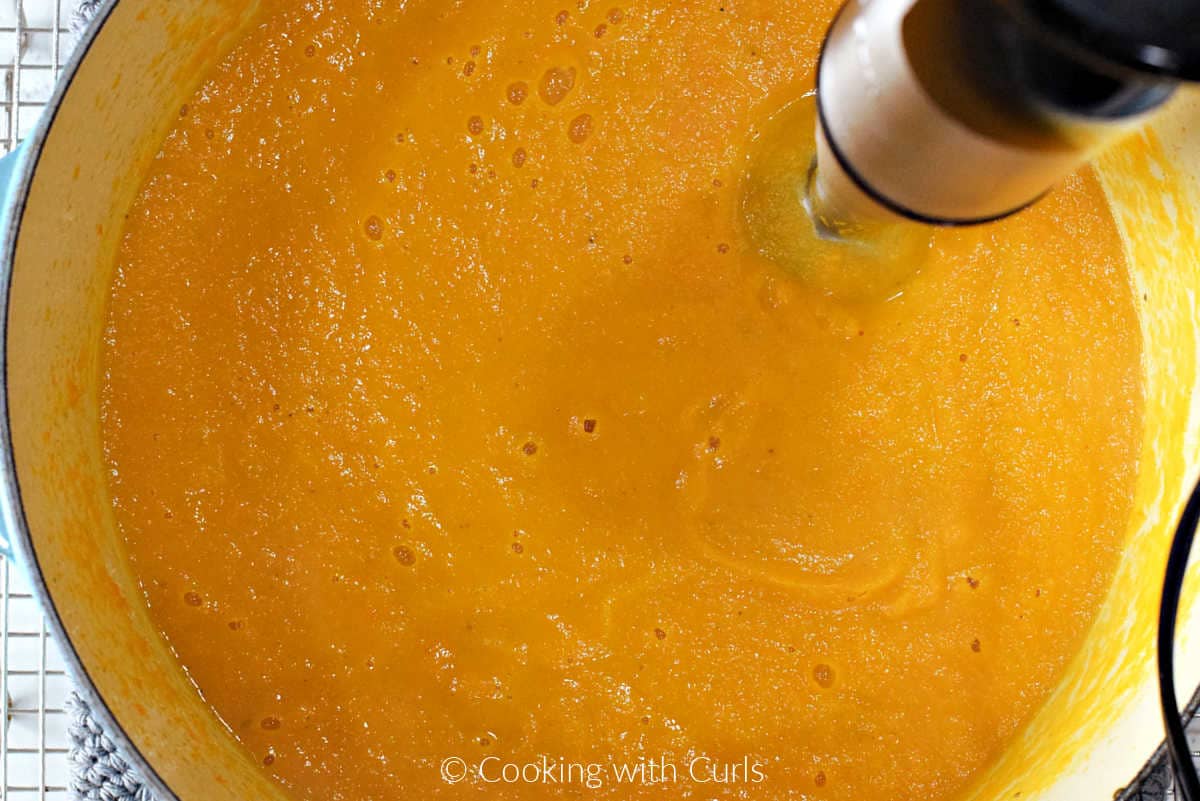 Pureed carrot ginger soup in a large Dutch oven.