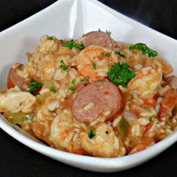 Shrimp Jambalaya with sliced sausage and chicken with rice in a bowl.