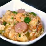 This traditional Shrimp Jambalaya is loaded with shrimp, chicken and sausage in a spicy creole sauce! cookingwithcurls.com