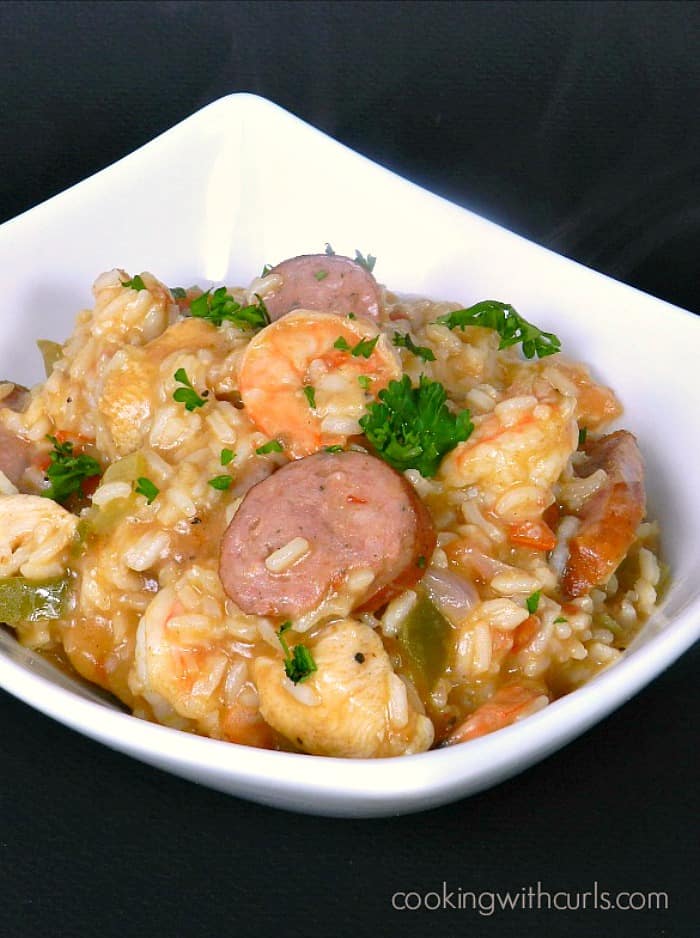 This traditional Shrimp Jambalaya is loaded with shrimp, chicken and sausage in a spicy creole sauce! cookingwithcurls.com 