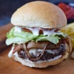 You have to try this Bistro Burger topped with garlic aioli, caramelized onions, thick bacon, and surrounded by soft, fluffy buns | cookingwithcurls.com