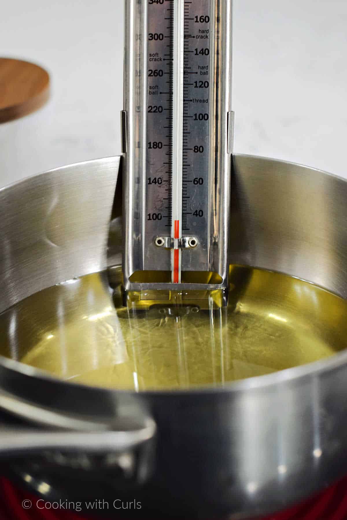 Deep fry thermometer in a pan of oil.