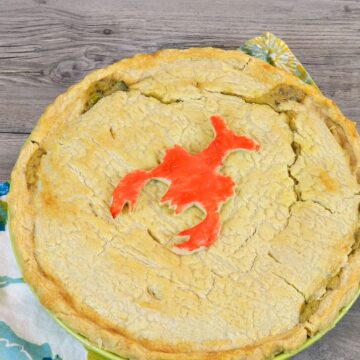 Looking down on a Lobster Pot Pie Pie with a cute red painted lobster cookie on top.