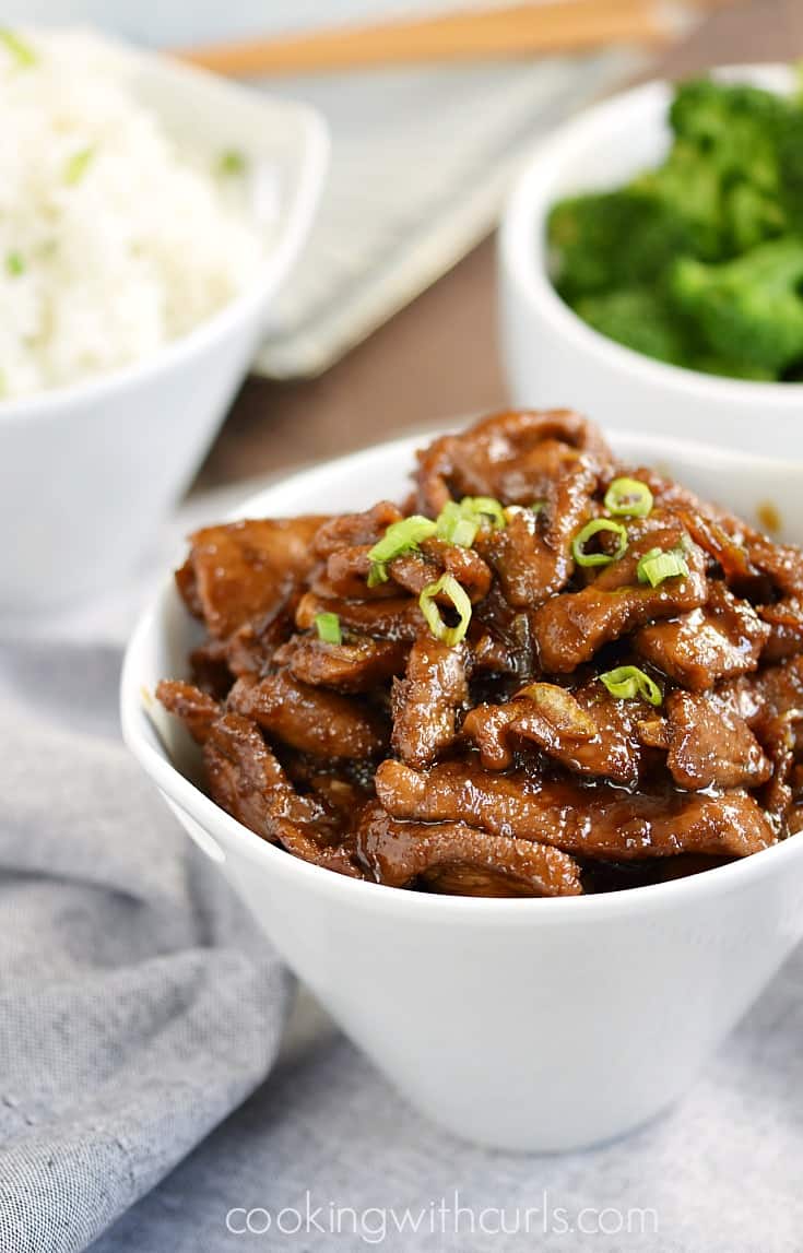 My all-time favorite Mongolian Beef recipe with thinly sliced sirloin, tangy Asian sauce, and sweet caramelized onions will beat out any restaurant meal | cookingwithcurls.com