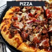 Close-up image of a sliced bacon cheeseburger pizza topped with cheese, beef, bacon, tomato, and barbecue sauce on a blue plate with title graphic across the top.