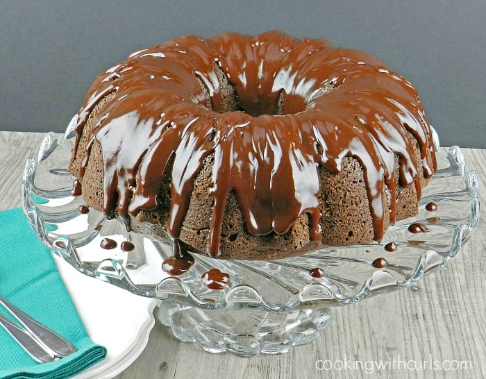 Chocolate Peppermint Cream Cheese Bundt Cake on a crystal cake plate