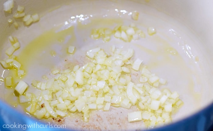 Chopped onions sautéed in oil in a large pot.