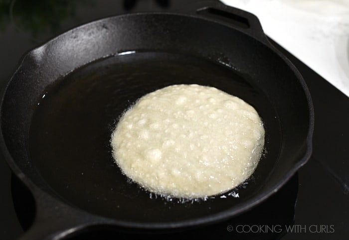 Fry the corn tortilla in hot oil in a cast iron skillet to soften cookingwithcurls.com