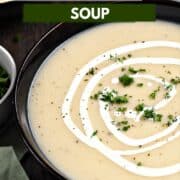 Traditional Irish Potato Leek Soup in a dark bowl drizzled with cream and sprinkled with minced parsley with title graphic across the top.