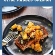 A portion of spice rubbed salmon topped with chopped papaya and mango salsa on a blue plate with title graphic across the top.