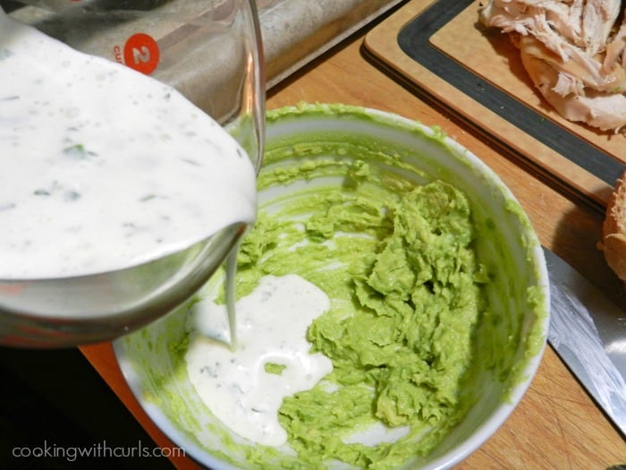 Ranch dressing mixed with the mashed avocado in a small bowl.
