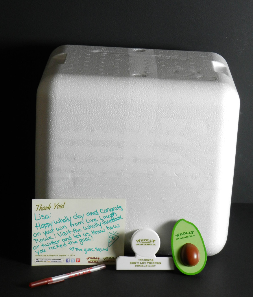 white Styrofoam ice chest with a thank you card, pen, foam avocado and chip clip leaning against it