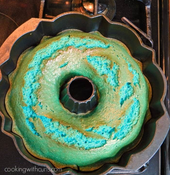 a Blue Kamikaze Cocktail Cake baked in a bundt pan sitting on top of the stove 