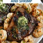 Looking down on a plate of Grilled Steak and Shrimp topped with garlic-lemon butter and title graphic across the top.