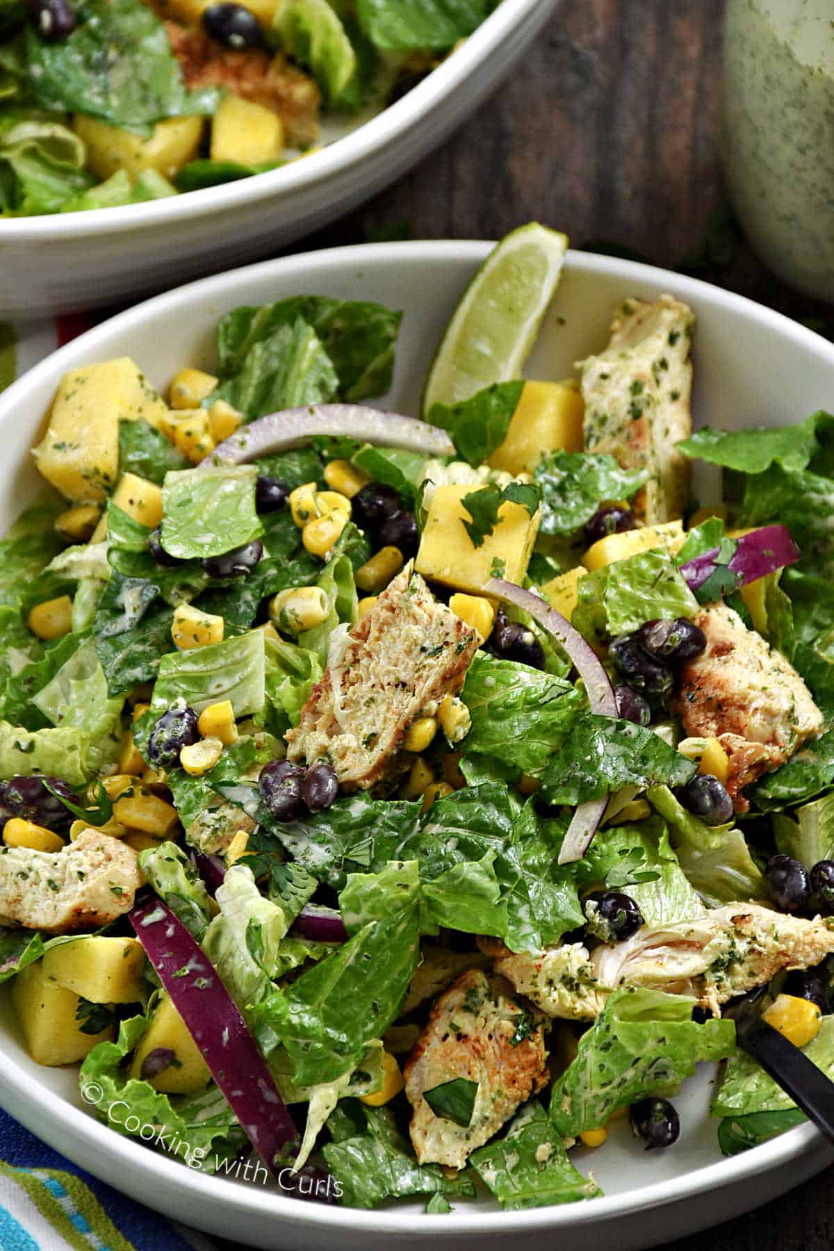 Tossed Southwest Chicken Salad in a bowl tossed with creamy cilantro-lime dressing.