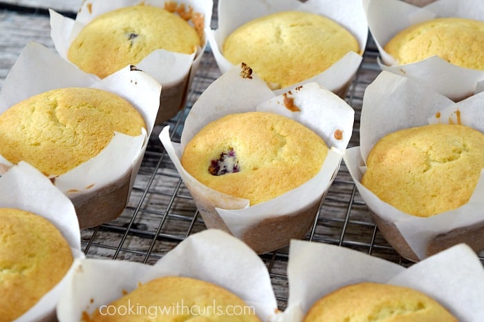 Baked muffins on a wire cooling rack.