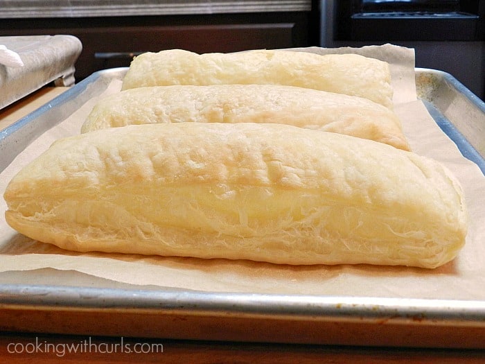 Puff pastry sheets baked to perfection on a parchment lined baking sheet cookingwithcurls.com