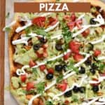 A rectangle pizza topped with lettuce, chicken, tomatoes, olives, guacamole, and sour cream with title graphic across the top.