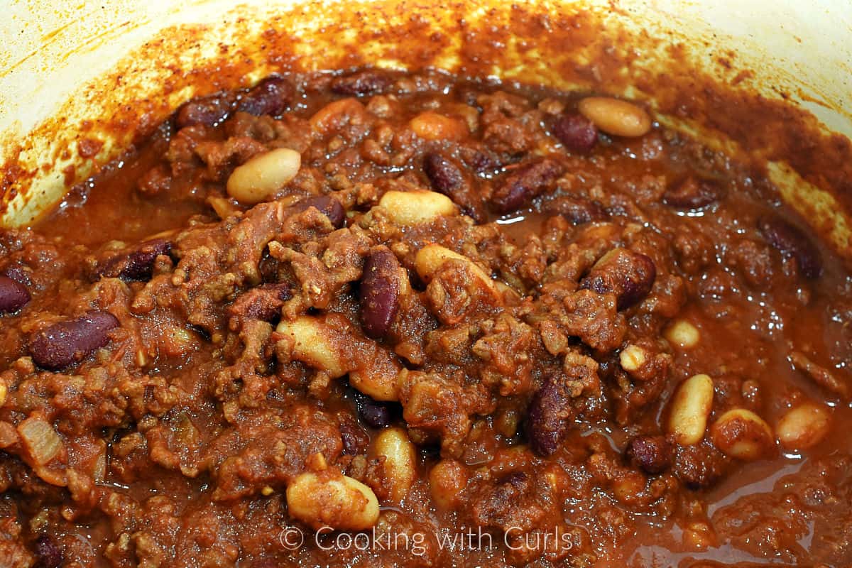 A big pot of chili with red and white kidney beans and ground beef. 