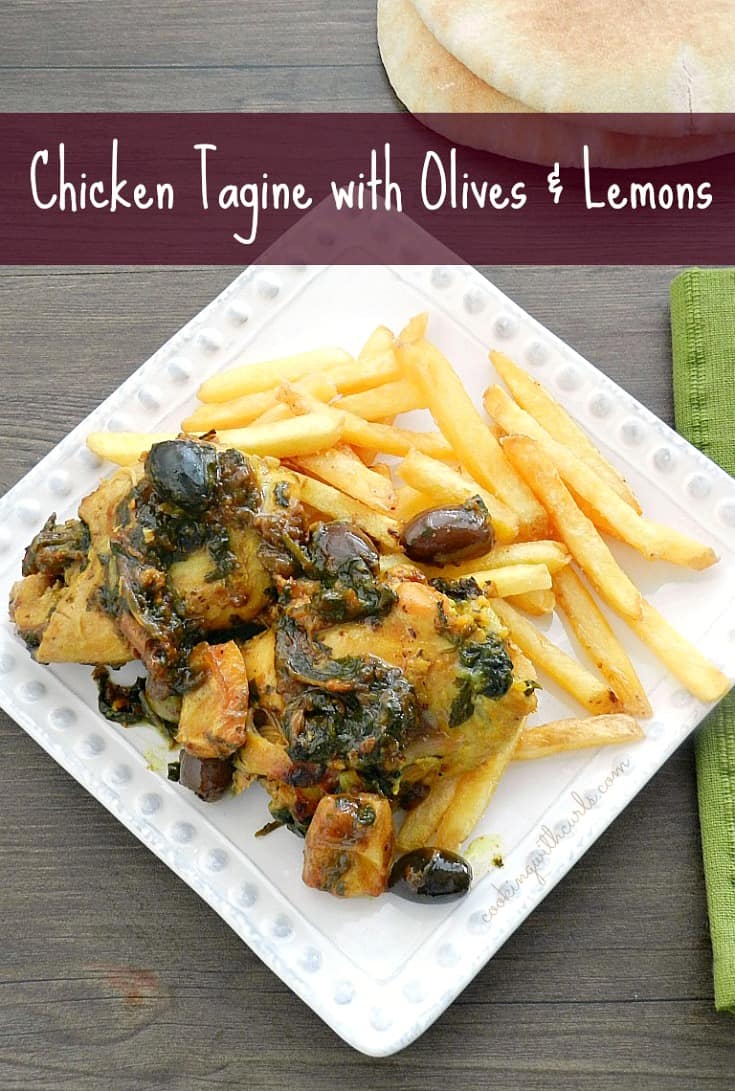 Looking down on Chicken Tagine with Olives and Lemons served on a bed of french fries