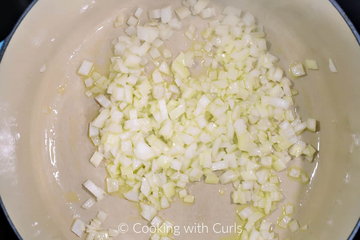 Chopped onions in a large pot with oil. 