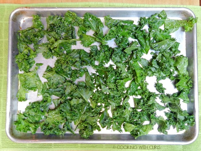 Seasoned kale on a baking sheet