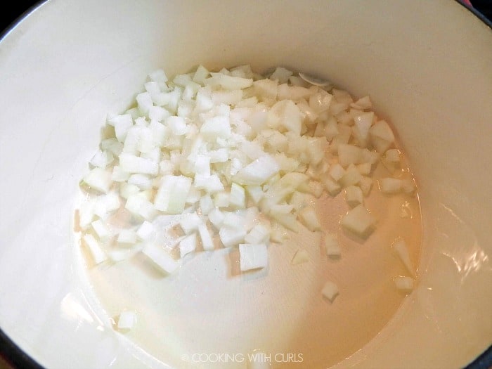 Chopped onions in a large pot .
