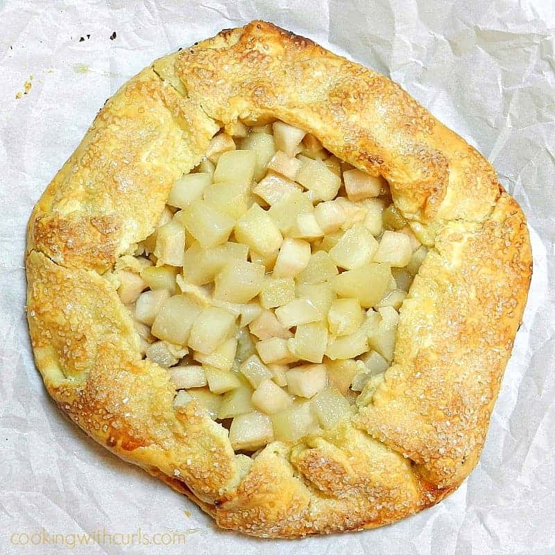 A delicious Pear and Maple Galette sitting on white parchment paper