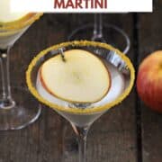 A sugar rimmed martini glass with caramel and apple vodka and an apple slice floating on top with title graphic across the top.