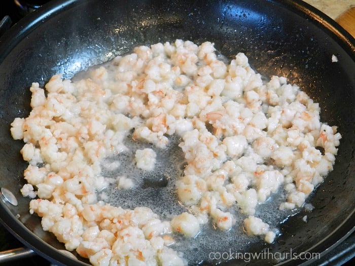 Shrimp cooking in a non-stick pan cookingwithcurls.com