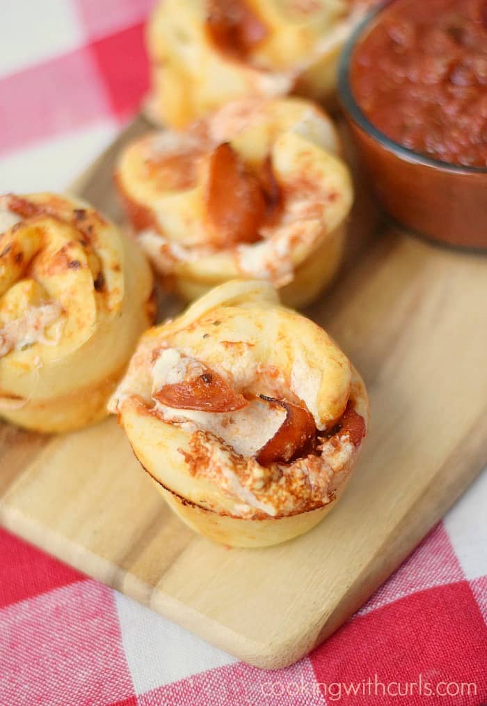 These light and fluffy Pepperoni Pizza Muffins are super easy to make and everyone loves them! cookingwithcurls.com