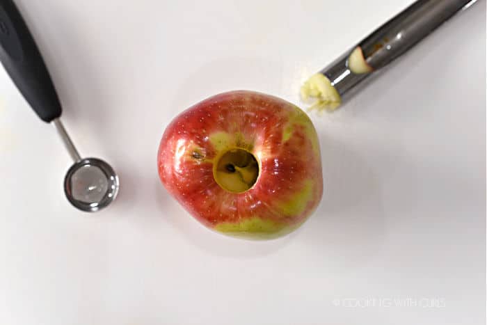 looking down on an apple that has been partially cored with an apple corer. 