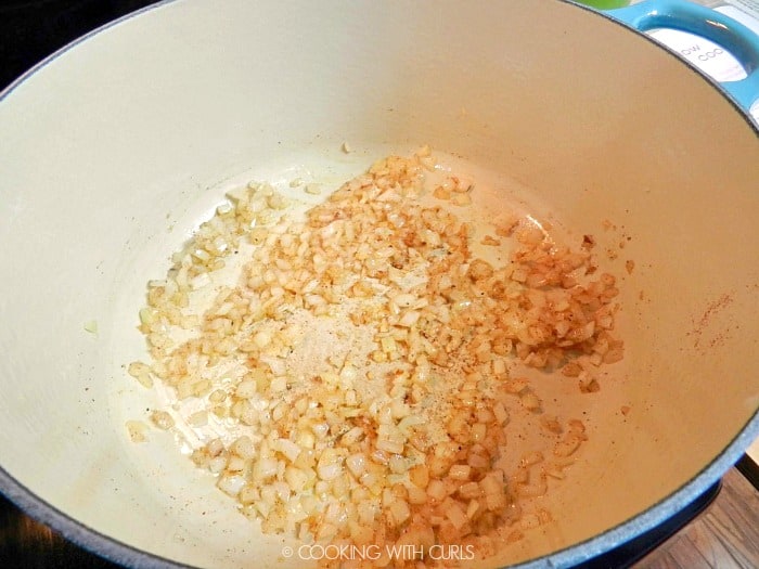 Onions, garlic and seasonings in a large pot cookingwithcurls.com
