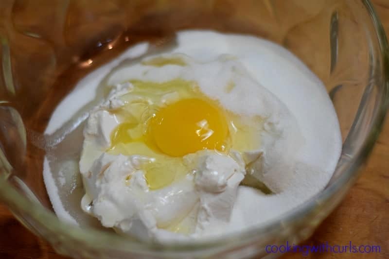 Cream cheese, sugar and one egg in a large mixing bowl.