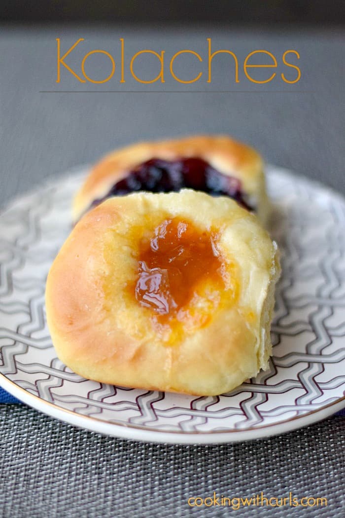 apricot and blueberry kolaches sitting on a gray and white zigzag plate