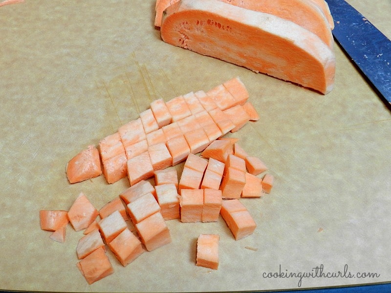 diced sweet potato on a cutting board