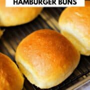 Four hamburger buns on a wire cooking rack with title graphic across the top.