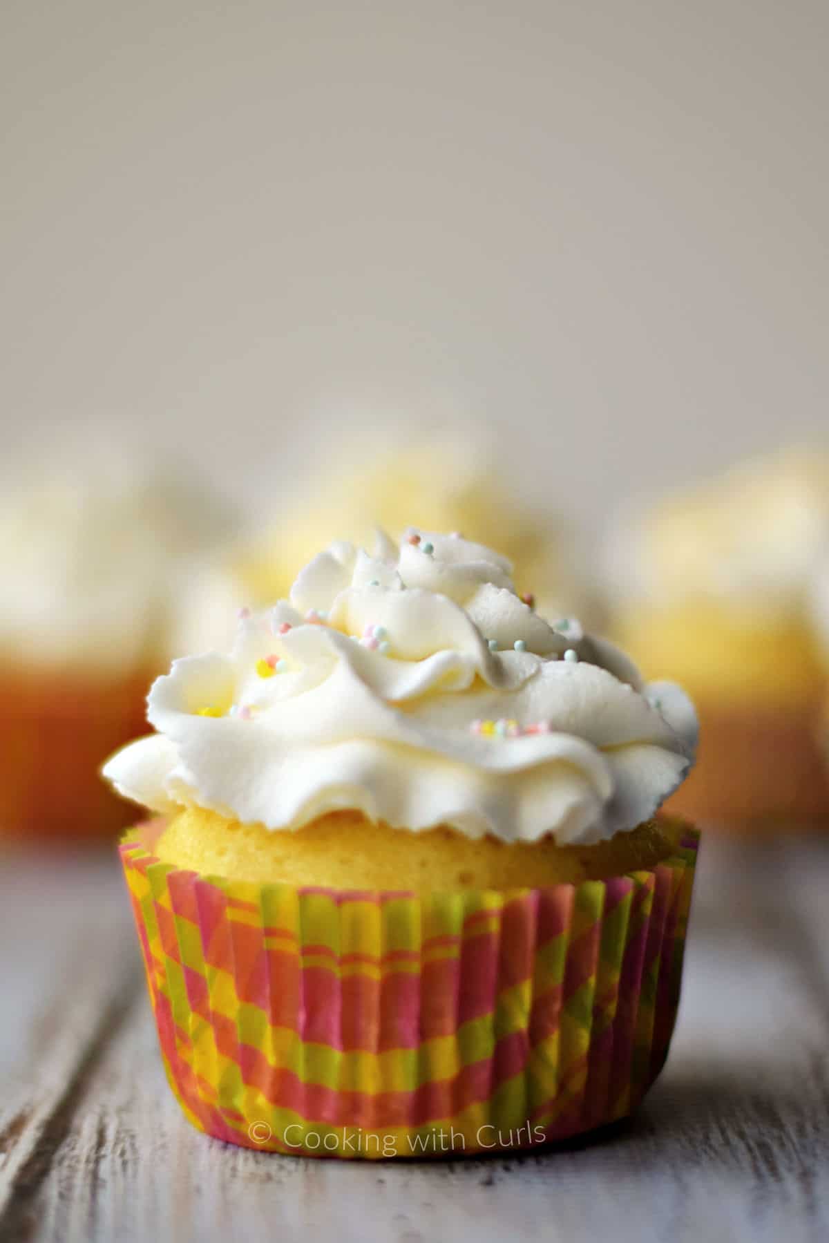 Limoncello-cupcakes-topped-with-limoncello-frosting-and-colored-sprinkles.