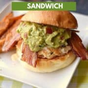Chicken breast topped with melted cheese, bacon slices, and guacamole on a hamburger bun and sweet potato fries on the side and title graphic across the top.