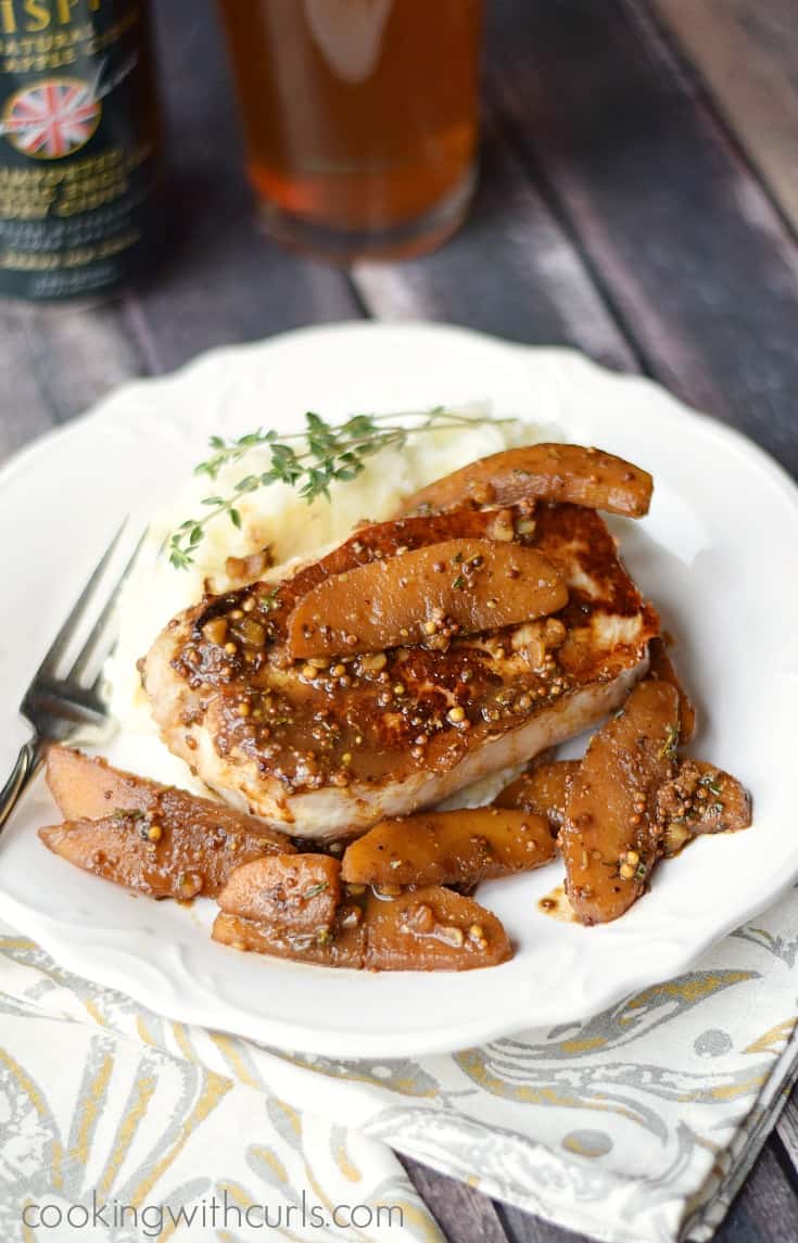 Pork Chops with Apple and Cider Sauce is comfort food at it's finest | cookingwithcurls.com