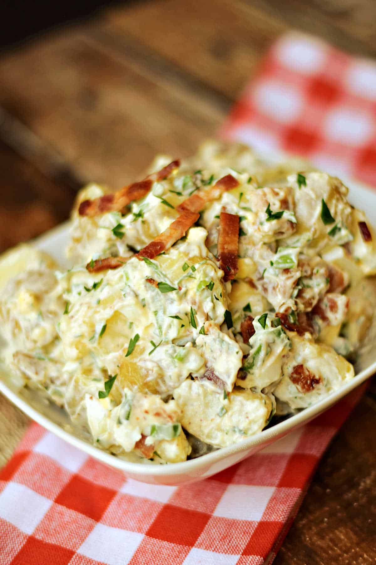 Bacon potato salad in a serving bowl.