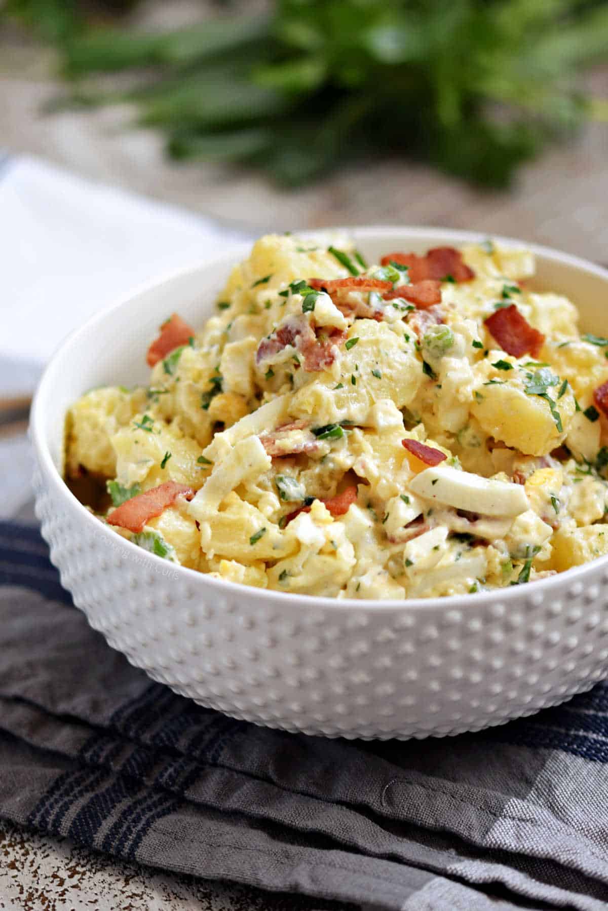 Bacon potato salad in a serving bowl.