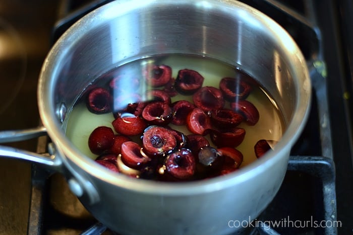 Cherry halves, sugar and water in a saucepan.