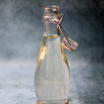 Simple Syrup in a clear glass bottle.
