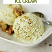 Pistachio Ice Cream topped with Pistachio Praline in a white rectangle dish with a spoon on the side and title graphic across the top..