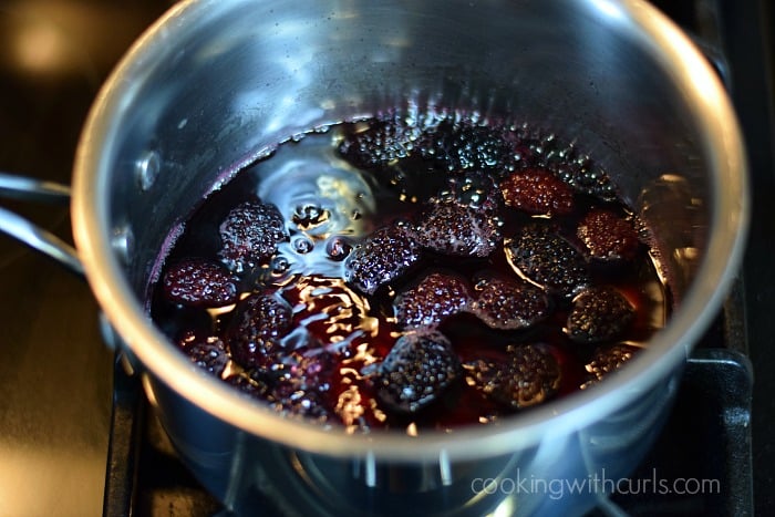 Blackberry syrup cooling in a saucepan.