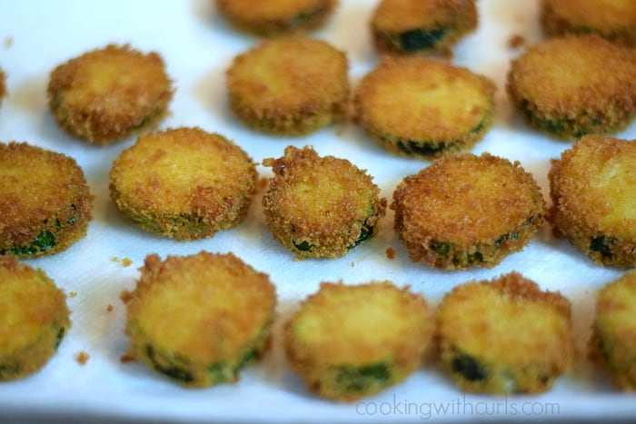 Fried Zucchini draining on paper towels.