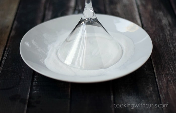 Martini glass upside down in a sugar filled plate.